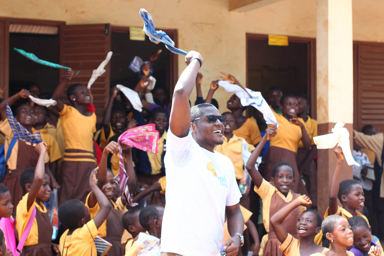 children rejicing with SmileAtSchool executive- courtesy smileatschool